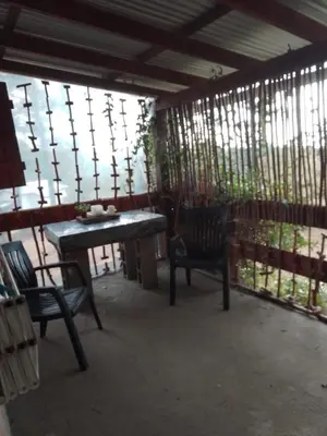 a screened in porch with a table and chairs at Luna Plateada - Terrafirme in Villa Yacanto