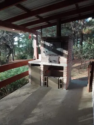 an outdoor grill with a television on top of it at Luna Plateada - Terrafirme in Villa Yacanto
