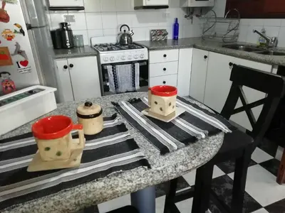 a kitchen with a counter with two containers on it at La casa de Lily in Alta Gracia