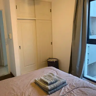 a bedroom with a bed with towels on it at Hipólito Yrigoyen 150 in Cordoba
