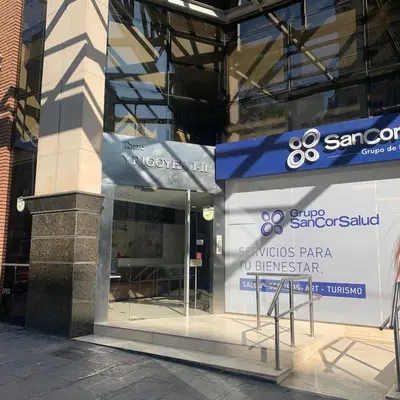 a store with a sign in the window of a building at Hipólito Yrigoyen 150 in Cordoba