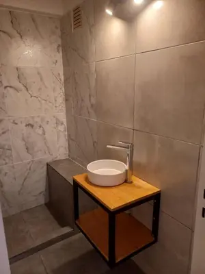 a bathroom with a sink on a wooden table at Departamento 1 Dormitorio - Buenos Aires 1100 - Nueva Cordoba in Cordoba
