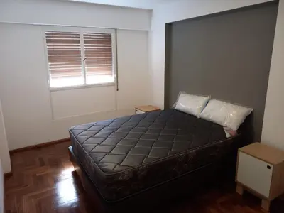 a bedroom with a large bed with a window at Departamento 1 Dormitorio - Buenos Aires 1100 - Nueva Cordoba in Cordoba