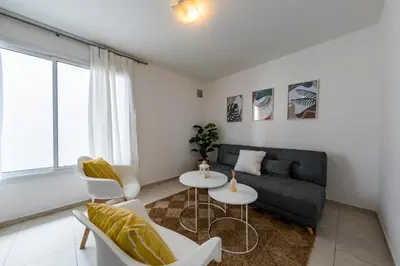 a living room with a couch and a table and chairs at Viaggiato Obispo Salguero in Cordoba