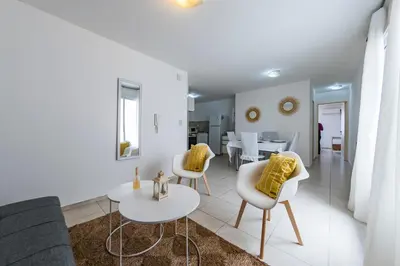 a living room with a couch and chairs and a table at Viaggiato Obispo Salguero in Cordoba