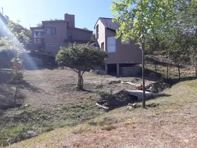 a house on a hill with a yard with trees at El Refugio in Cordoba