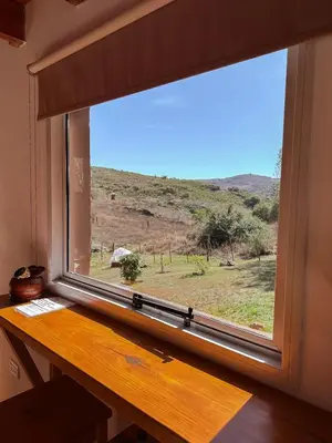 a window with a view of a field at El Refugio in Cordoba