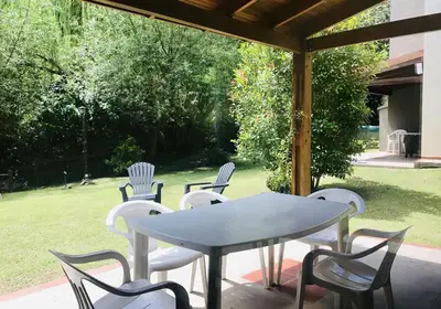 a table and chairs sitting under a gazebo at Cabañas El Francés in Merlo