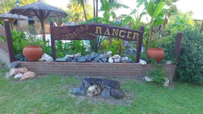 a sign for a yard with a rock garden at Cabañas Ranger in Santa Rosa de Calamuchita