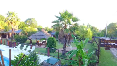 a resort with a picnic table and a gazebo at Cabañas Ranger in Santa Rosa de Calamuchita