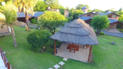 an aerial view of a hut with chairs in a yard at Cabañas Ranger in Santa Rosa de Calamuchita