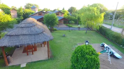 an aerial view of a backyard with a playground at Cabañas Ranger in Santa Rosa de Calamuchita