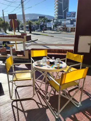 a table and chairs sitting on a patio at Hotel Ritz in Villa Carlos Paz