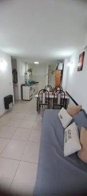 a living room with a bed and a dining room at Fantástico Dpto Av Maipu 518 in Cordoba