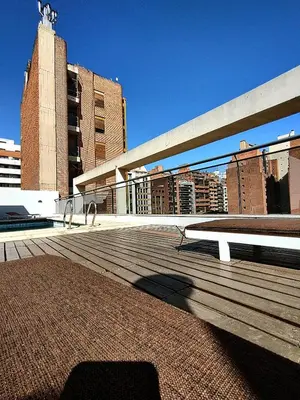 a boardwalk with a bench on top of a building at Paraná Terrazas Nva Cordoba in Cordoba