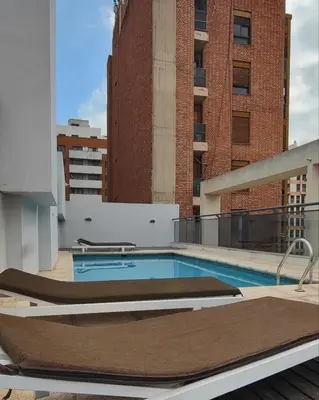 a swimming pool on the roof of a building at Paraná Terrazas Nva Cordoba in Cordoba
