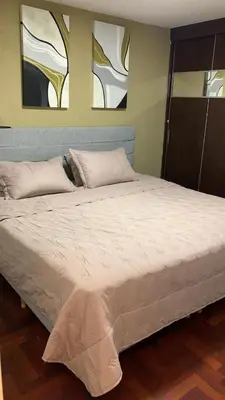 a bedroom with a large bed with two pillows at Moderno Departamento Acogedor in Cordoba