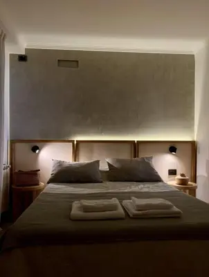 a bedroom with a large bed with two towels on it at LOAN Nueva Cordoba categoría appart 11B in Cordoba