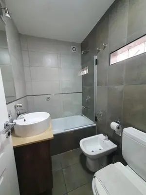 a bathroom with a sink and a toilet and a tub at LOAN Nueva Cordoba categoría appart 11B in Cordoba