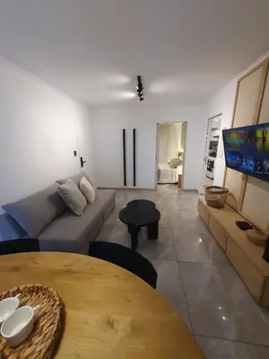 a living room with a couch and a table at LOAN Nueva Cordoba categoría appart 11B in Cordoba