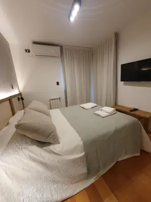 a bedroom with a large bed with two towels on it at LOAN Nueva Cordoba categoría appart 11B in Cordoba