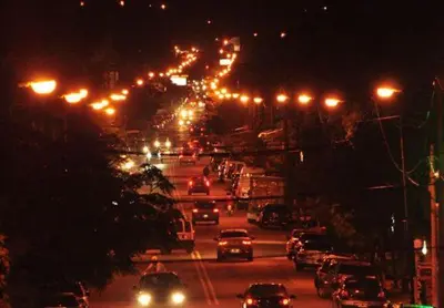 a busy city street with lots of traffic at night at Depto Av del Sol in Merlo