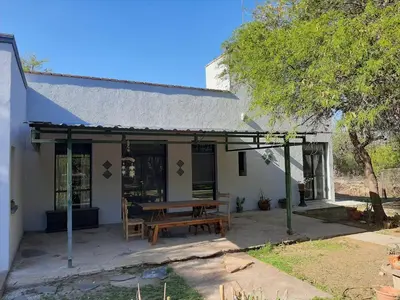a house with a picnic table in front of it at Indigo in Carpintería