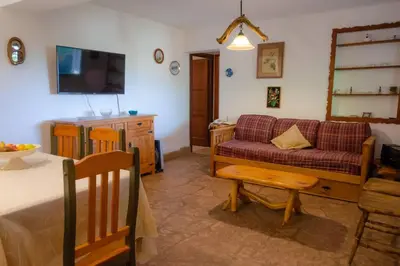 a living room with a couch and a table at Unser traum in Villa General Belgrano