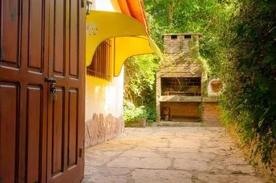 an entrance to a building with a stone walkway at Unser traum in Villa General Belgrano