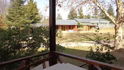 a view from the window of a house at Samai Suma Cabañas & Spa in Villa General Belgrano