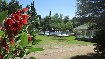 a view of a swimming pool in a yard at Samai Suma Cabañas & Spa in Villa General Belgrano