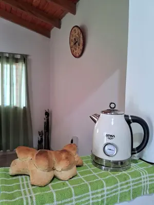a tea kettle sitting on top of a table at Casa del Sol in Santa María
