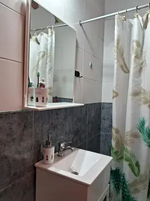 a bathroom with a sink and a mirror at Casa del Sol in Santa María