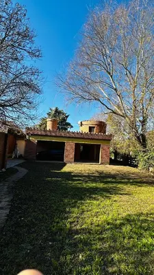 a house in a yard with a grass field at Casa grande 5 pax San Antonio de Arredondo CORDOBA in San Antonio de Arredondo