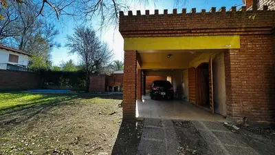 a car is parked inside of a garage at Casa grande 5 pax San Antonio de Arredondo CORDOBA in San Antonio de Arredondo