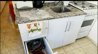 a kitchen with a sink and a counter top at Deptos carlos paz in Villa Carlos Paz