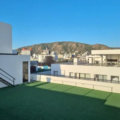a view from the roof of a building with a green lawn at Moderno Dpto Centrico in Villa Carlos Paz