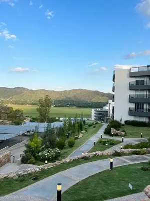 arial view of a building and a street in front of a building at Departamento Veneto Village - B in Villa Parque Siquiman