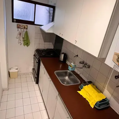 a small kitchen with a sink and a stove at Eugenio Garzón 448 in Cordoba