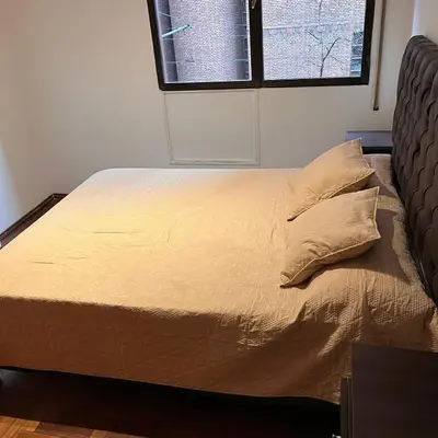 a large bed in a room with a window at Eugenio Garzón 448 in Cordoba