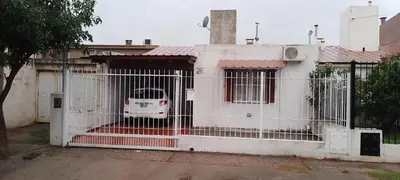 a white fence with a gate in front of a house at Casa de Julia in Cordoba