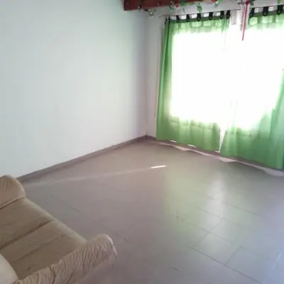 a living room with a couch and a window at Casa de Julia in Cordoba