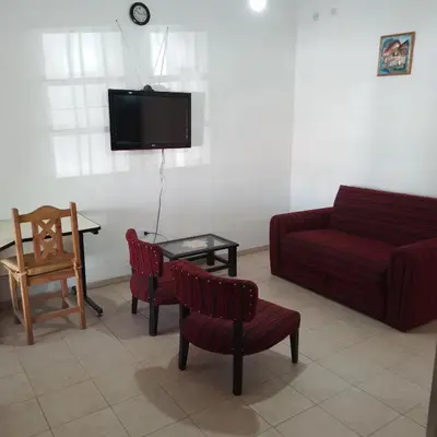a living room with a couch and chairs and a table at Casa de Julia in Cordoba