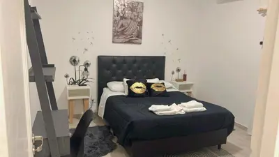 a bedroom with a blue bed with two pillows at Casa Naranja habitaciones privadas in Cordoba