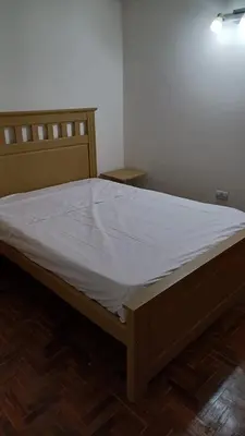 a bed in a room with a white mattress at tu lugar 1 in Cordoba