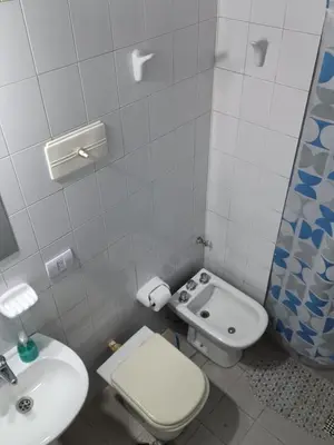 a small bathroom with a toilet and a sink at tu lugar 1 in Cordoba