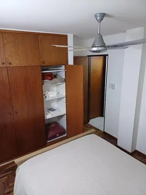 a bedroom with a bed and a closet at tu lugar 1 in Cordoba