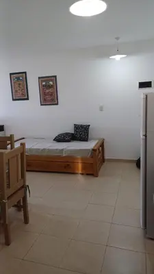 a room with a bed in the corner of a room at tu lugar 2 in Cordoba