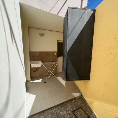 a large black door on the side of a building at Dorrego Departamentos in Villa Dolores