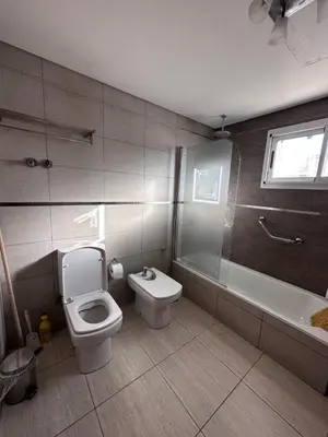 a bathroom with a toilet and a tub and a sink at Casa Valle del colibrí in Cañada La Negra